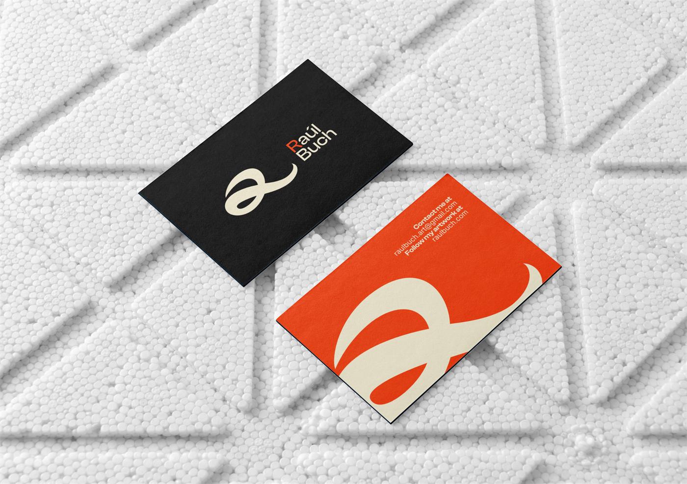 Raúl Buch business cards in black and orange with the calligraphic R
